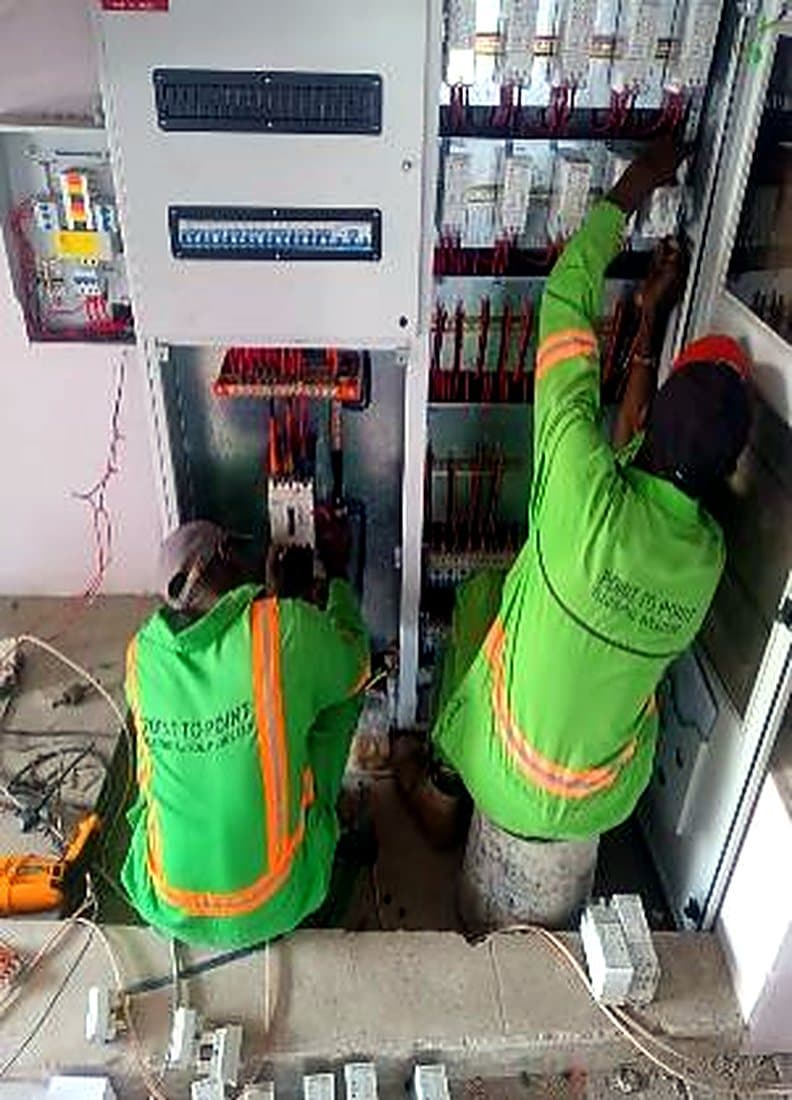 Technician terminating a distribution board